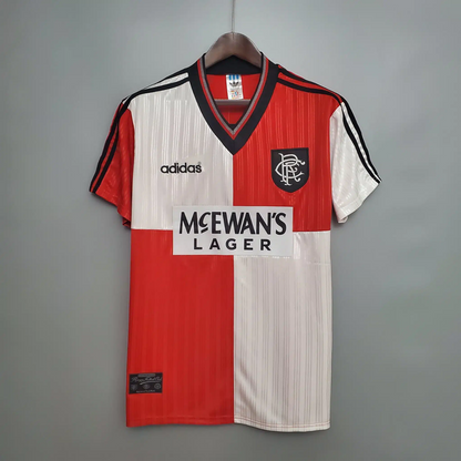 Chequered Red and white Rangers Away football jersey from 1995/96 with Adidas logo and McEwan's Lager branding on a gray background