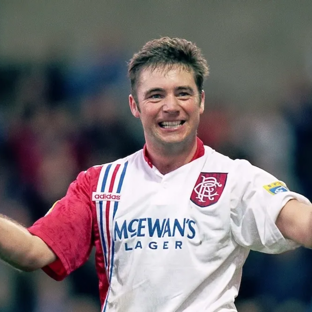 White & Red Rangers football away jersey from 1996/97 with red and blue accents, featuring Adidas logo and McEwan's Lager branding being worn by Ally McCoist as he celebrates