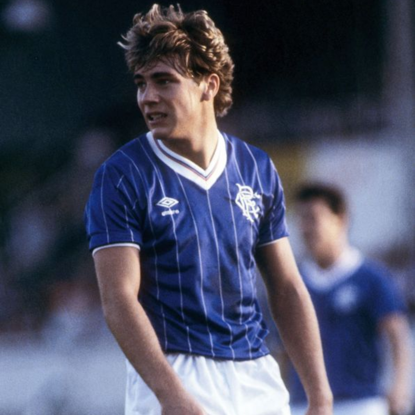 Blue striped Rangers sports jersey from 1982/83 made by Umbro worn by Ally McCoist during a football match