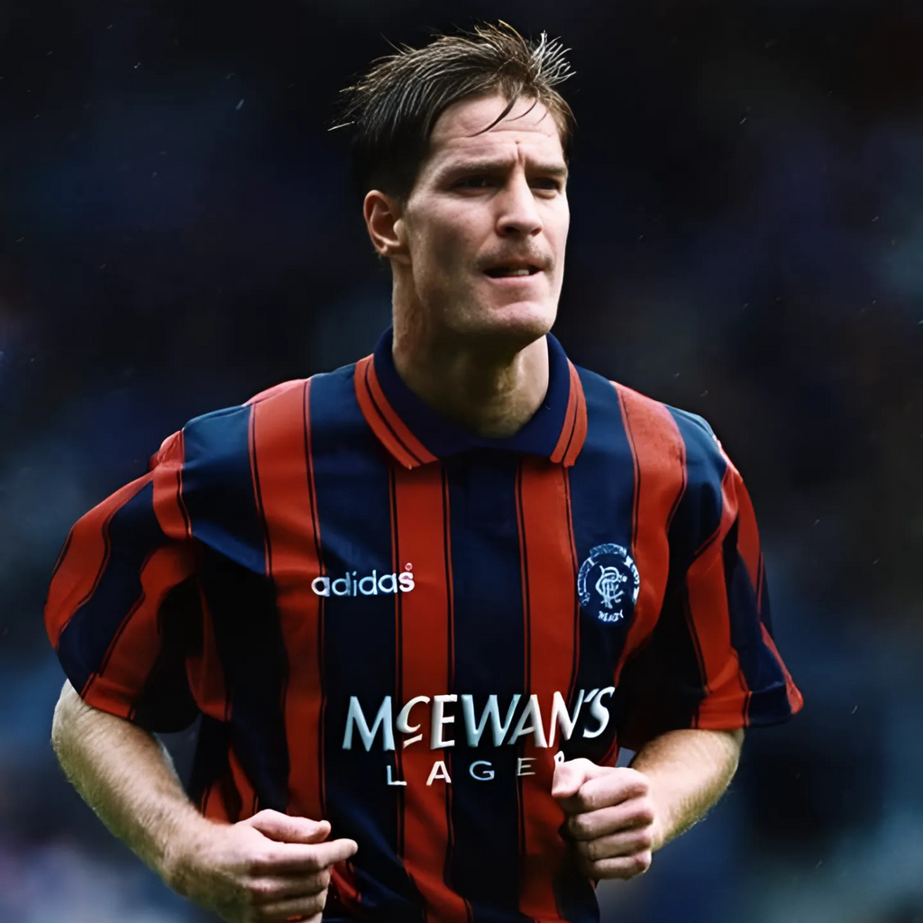 Blue and orange striped Rangers retro vintage sports jersey from 1994/95with Adidas and McEwan's Lager branding being worn by Richard Gough during a football match